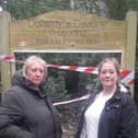Coun Andrea Kay (left) and Joanne Hargreaves-Doherty in front of the damaged notice board in The Towers Wood, Cleveleys
