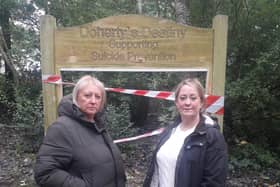 Coun Andrea Kay (left) and Joanne Hargreaves-Doherty in front of the damaged notice board in The Towers Wood, Cleveleys