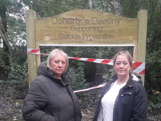 Coun Andrea Kay (left) and Joanne Hargreaves-Doherty in front of the damaged notice board in The Towers Wood, Cleveleys
