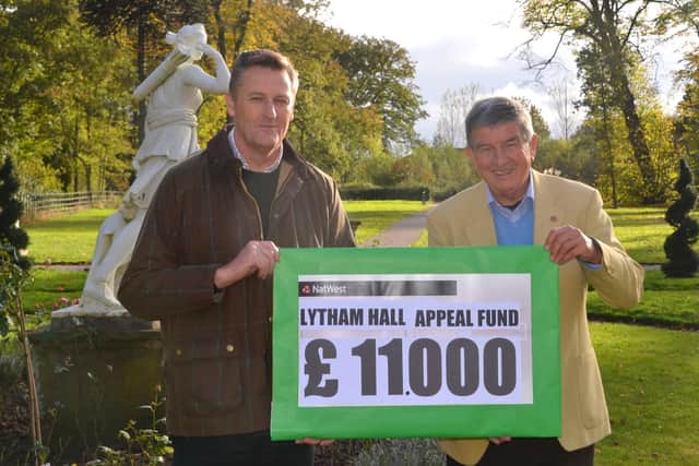 Lytham Hall manager Peter Anthony (left) receives the cheque for the record donation from plays organiser Julian Wilde