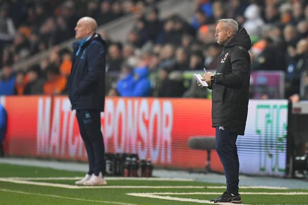 QPR boss Mark Warburton watches on alongside Neil Critchley