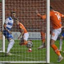 The ball is already over the line before Gary Madine gets a touch