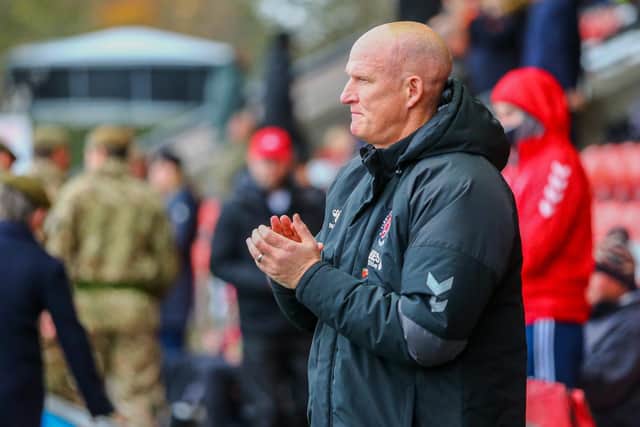Simon Grayson says players selected for Tuesday's Trophy tie could earn a place in his Fleetwood side for the next League One game against Morecambe