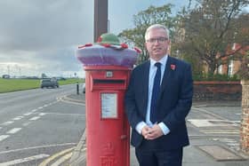 Fylde MP Mark Menzies at the knitted tribute on a post box in Lytham