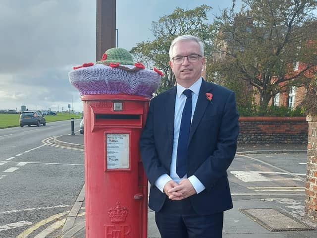 Fylde MP Mark Menzies at the knitted tribute on a post box in Lytham