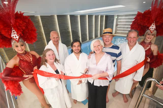 The official opening of the £400,000 pool at the Hotel Sheraton. Pictured are, showgirls Athena and Emily with Dr Julie Bradshaw MBE, Nigel Seddon, Hugo Ordonez, Liz Brown, Jonathan Brown and Quentin Hayes.