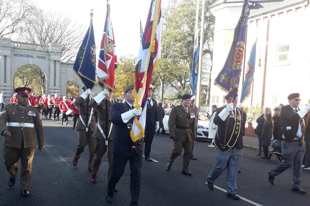 Proud standard bearers in the Fleetwood Remembrance Day parade make their down Warrenhurst Road,  after the service in the Memorial Park.