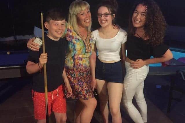 Marshall Metcalfe with his mum and sisters