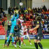Fleetwood Town striker Joe Garner challenges Morecambe keeper Jokull Andresson Picture: Sam Fielding/PRiME Media Images Limited