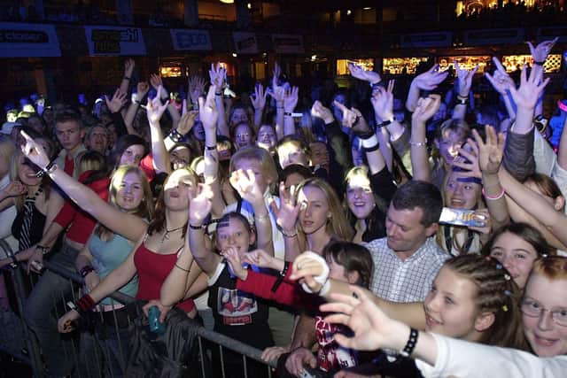 Fans wait for a glimpse of Busted when they performed an invitation only gig at the Tower, November 2003