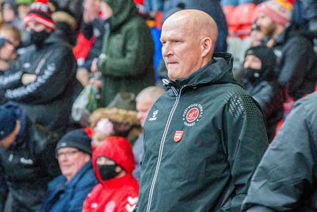 Simon Grayson feels as though the whole world is against his Fleetwood Town side