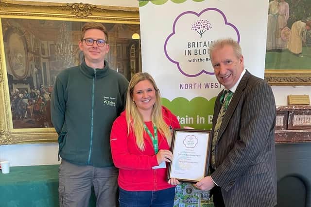 Andy Mills, Fylde Council Ranger, and Amy Pennington,from the Lancashire Wildlife Trust, receive their award from Coun Harrison