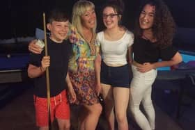 Marshall Metcalfe with mum Jane and his two sisters