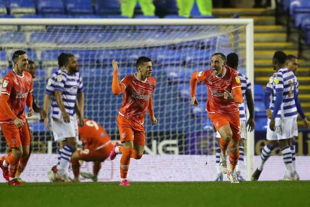 Owen Dale (centre) celebrates his first Blackpool goal in last month's victory at Reading