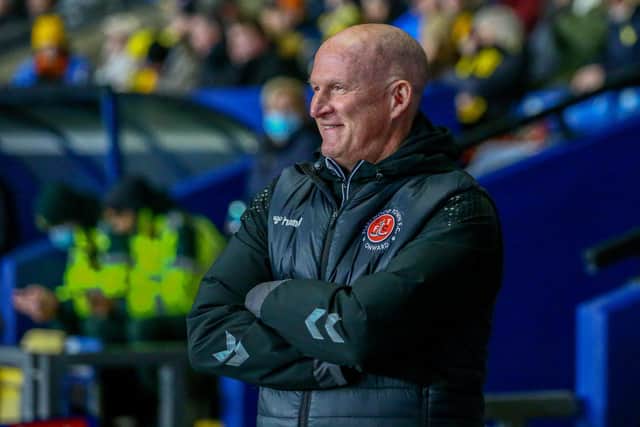Simon Grayson watches his final game as Fleetwood boss at Oxford on Tuesday