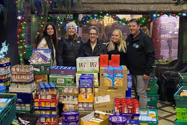 L-R Angela Molyneux from Locals Helping Locals, Bev Lucas CEO of the BPL food bank, Neil Reid Chair of the BPL food bank, Hayley Kay from Locals Helping Locals & Mark Wilkins Marketing Manager from Sandcastle Waterpark.