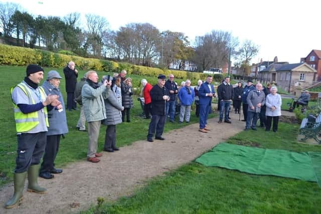 A crowd gathers to watch the tree-planting ceremony in tribute to Doreen Lofthouse MBE
