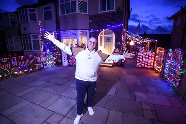 Paul Tilling at his home with Christmas lights and boards on display in Fleetwood