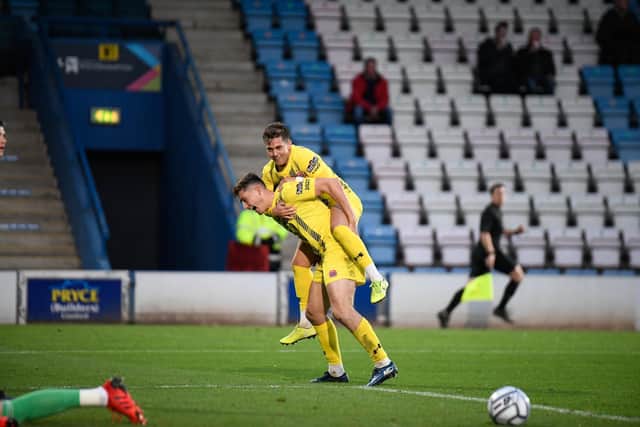 Joe Piggott gives a piggyback to Nick Haughton after scoring both Fylde's goals in the win at AFC Telford United two weeks ago Picture: STEVE MCLELLAN