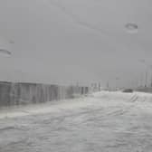 The sea foam also flooded the road near Rossall Promenade
