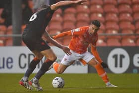 Owen Dale looks to get past his man during yesterday's defeat to Luton