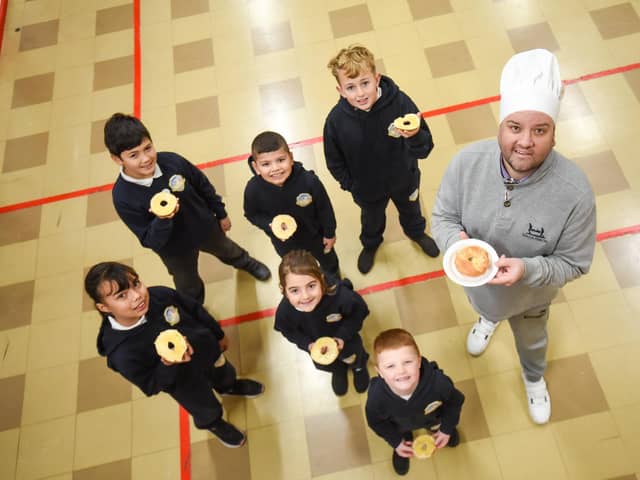 Headteacher Glyn Denton serves up Magic Breakfast bagels for Mayfield pupils