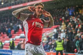 Harrison Biggins listens up for the applause as he seals a much-needed win for Fleetwood with two goals