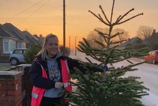Emma Lonican volunteering for the Trinity Hospice tree collection
