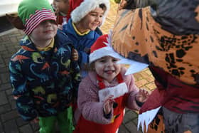 The class of three-year-olds handed out over 100 cards to spread Christmas cheer outside Costa Coffee and Lidl on Devonshire Road, Blackpool