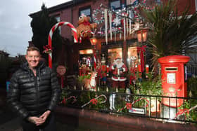 Michael Smith with his Christmas decorations outside his home in North Shore