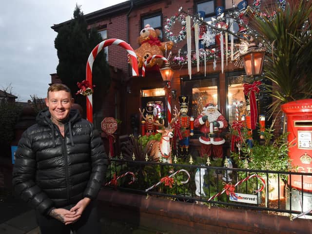 Michael Smith with his Christmas decorations outside his home in North Shore