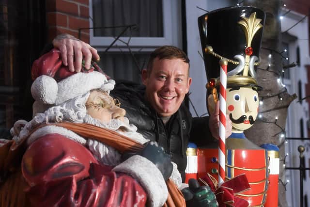 Michael Smith with his Santa an soldier figures