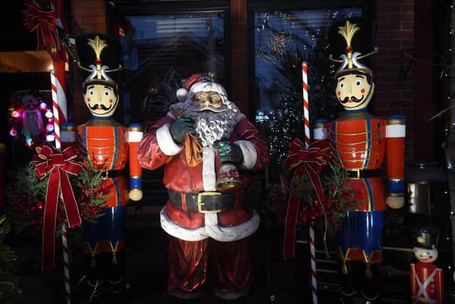 Santa flanked by two soldiers