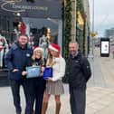 The Lingerie Lounge team is presented with its certificate for having the best festive windows in Blackpool
