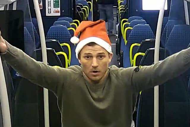 Police have released CCTV images of a suspect wearing a Santa hat after an officer was assaulted at Poulton train station on December 16