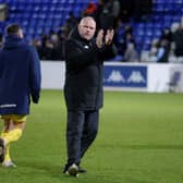 AFC Fylde manager Jim Bentley applauds supporters after the draw at Chester