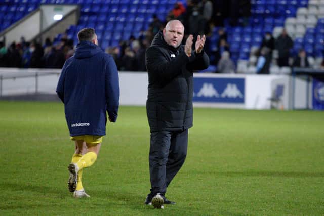 AFC Fylde manager Jim Bentley applauds supporters after the draw at Chester