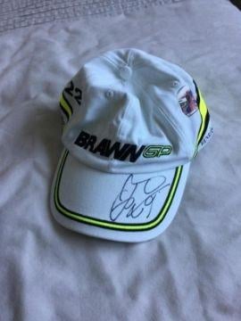 This Brawn F1 cap, signed by 2009 World Champion Jenson Button is one of the lots on offer