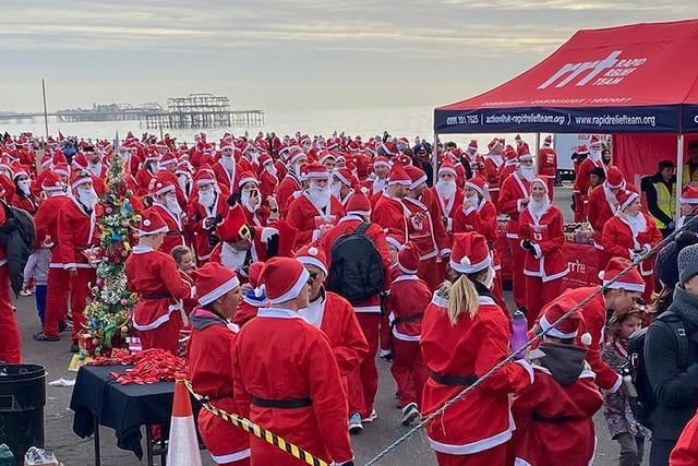 A sea of red and white as the Santas gather at the start