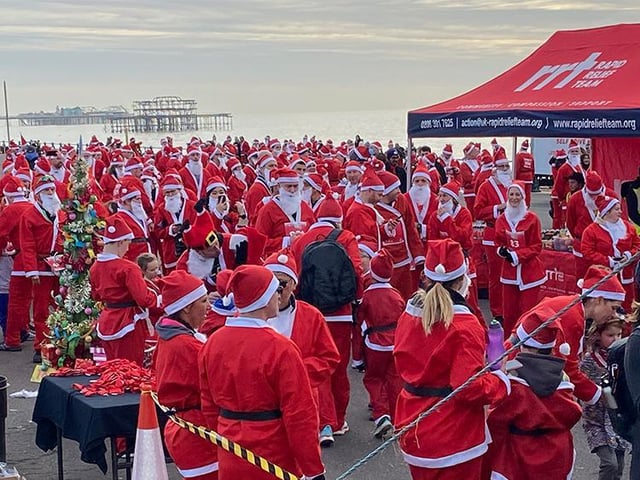 A sea of red and white as the Santas gather at the start