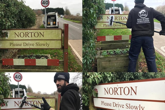 Ross gets to work on the sign in Norton.