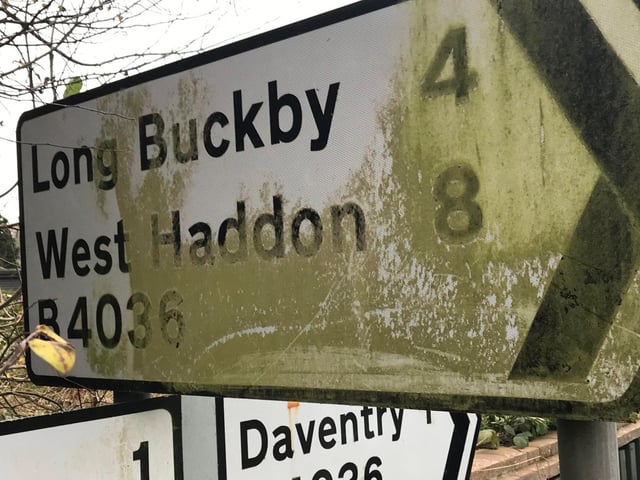 Mud makes it hard to see the way the road signs.