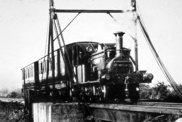 The engine Sidlesham pulling a Selsey-bound train crossing Chichester Canal around 1911