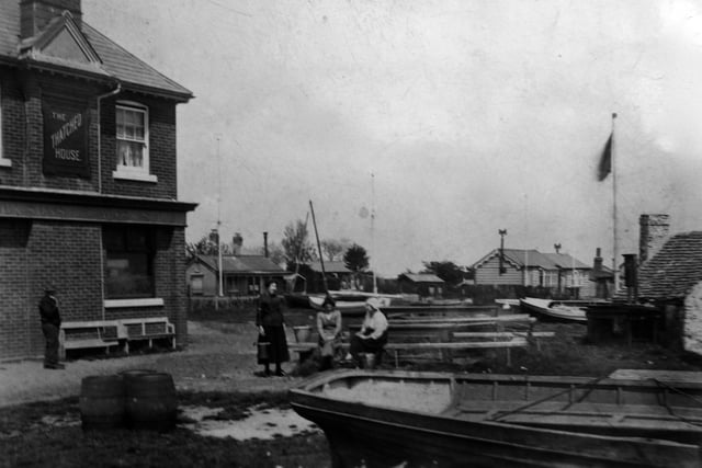 The Thatched House pub at Milton Lock
,
when it was surrounded by wooden cottages