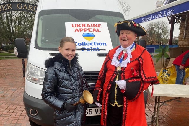Town Crier Dave Summers popped along to see how the appeal was going, pictured with Freya Lyon.