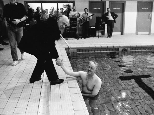 Rev. Joseph Carolan, P.P., Buncrana, congratulating Fr. Jimmy Doherty after he completed his ‘Swim Against M.S.’ in the Buncrana Leisure Centre pool.