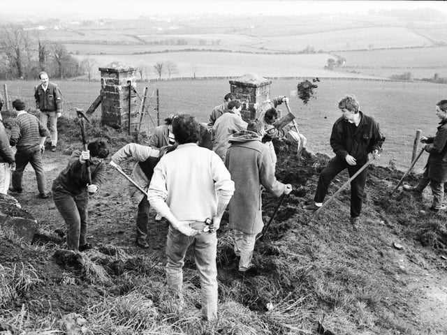 Members of the Derry/Donegal Border Community Association removing the ‘dragons’ teeth’ blocks on the Upper Killea Road outside Derry.
