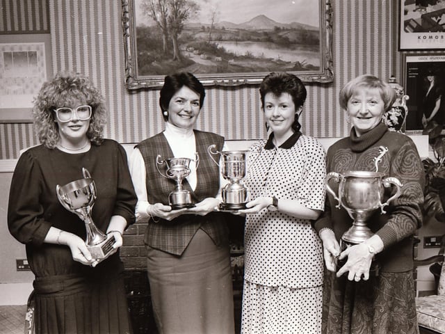 Mrs. Fidelma Doherty, captain, Redcastle Golf Club, presenting the ‘Golfer of the Year’ award to Mrs. Sylvia Huey, at an annual dinner in the Redcastle Hotel