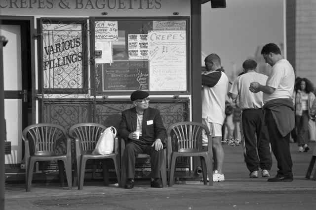 Customers at a snack bar on the seafront in 1998