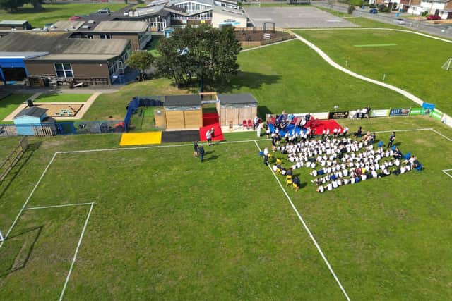 The opening ceremony of the stadium at Mayfield School as seen from above.